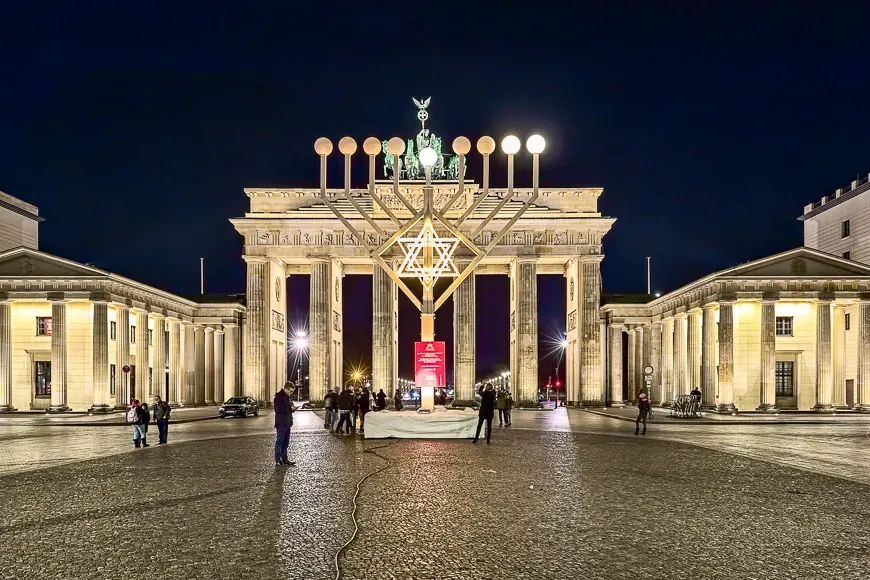 Hanukkah menorah at pariser platz (paris' square) in front of brandenburg gate night